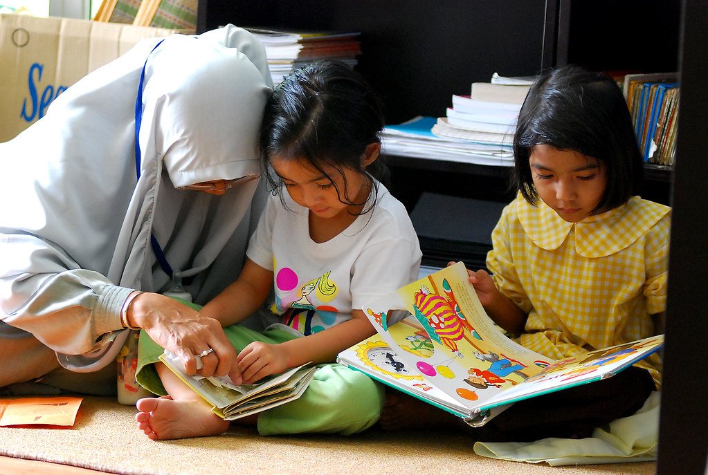 Teacher reading with children